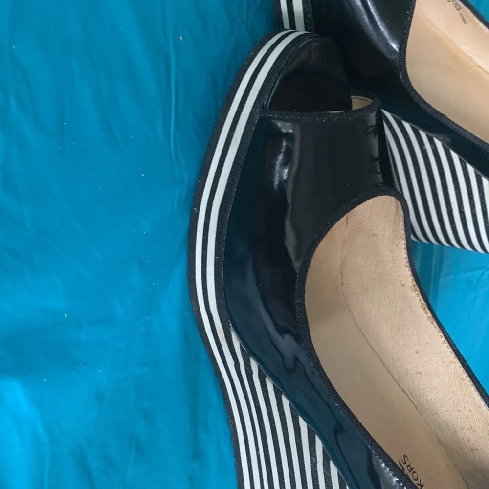Gently worn Michael Kors Adlai’s Black and Cream Strip Wedge Shoes.